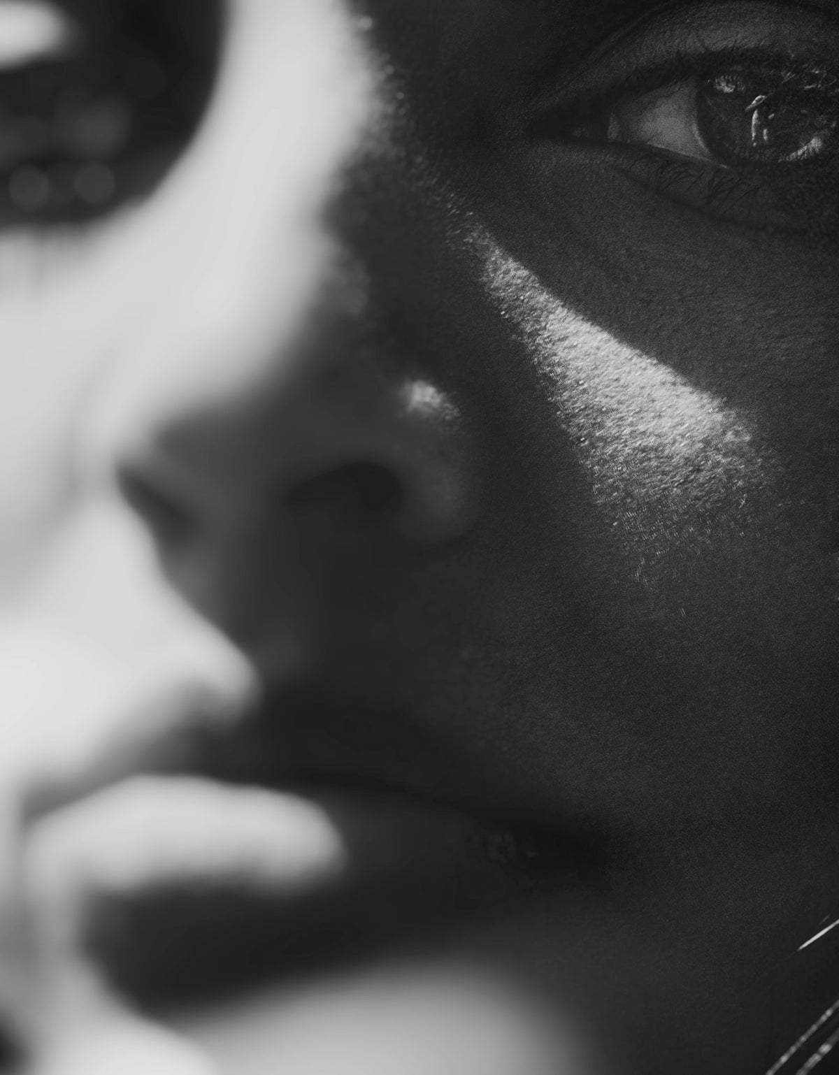 Close-up of a face in soft light, black and white