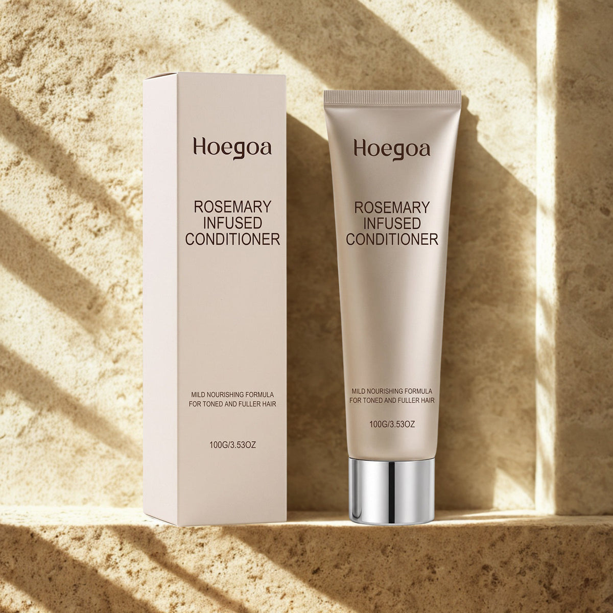 Rosemary Conditioner tube and box on a warm travertine stone ledge